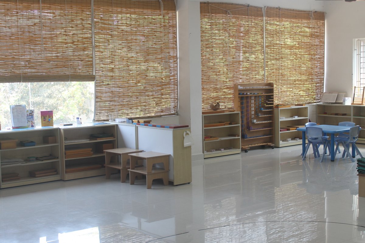 Children in the prepared Montessori environment at Kidoz, serving Medavakkam
